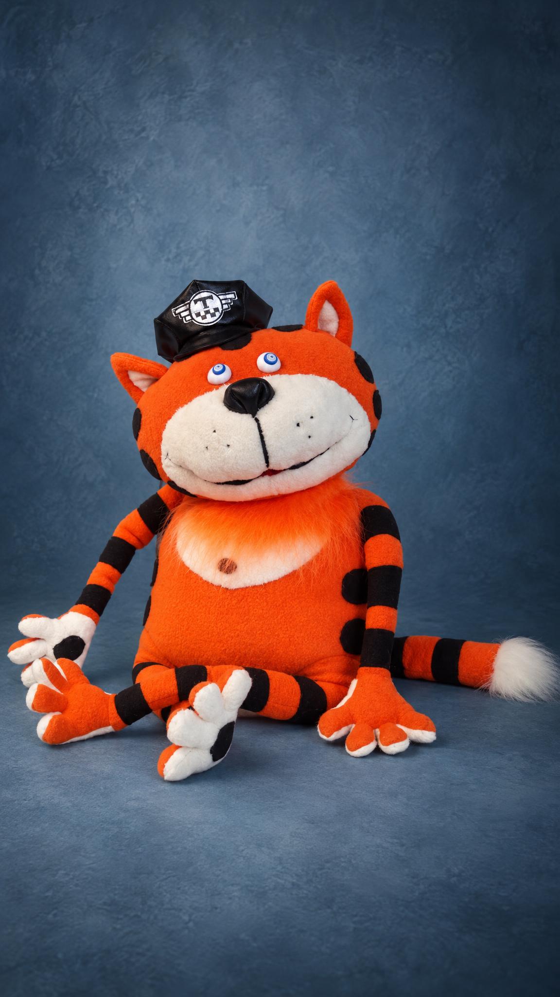 Custom cat plush taxi driver: orange fleece cat with black stripes, long legs and a white-tipped tail