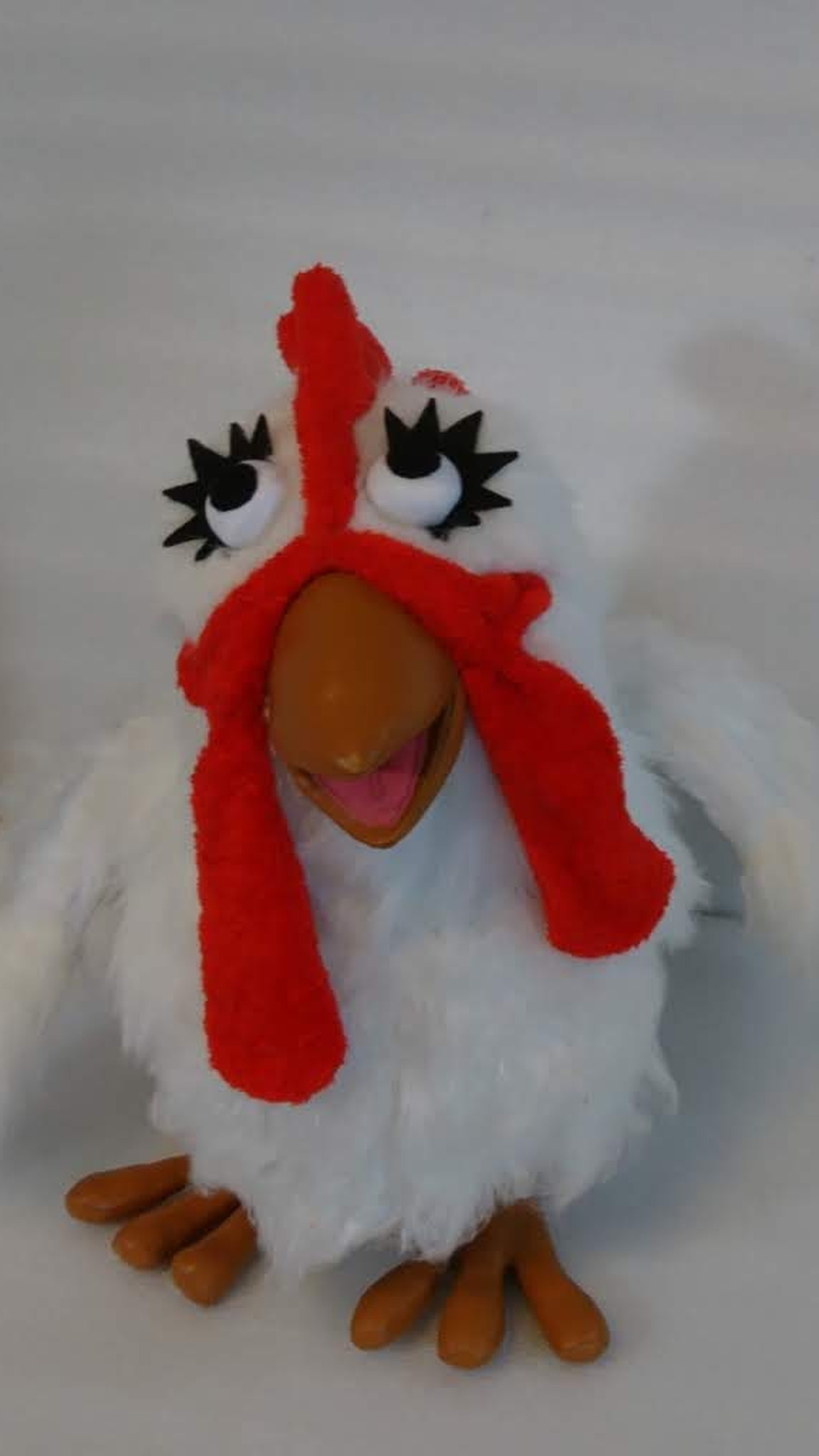 Custom chicken plush with long red wattles, black felt eyelashes and glossy orange feet, sewn to order