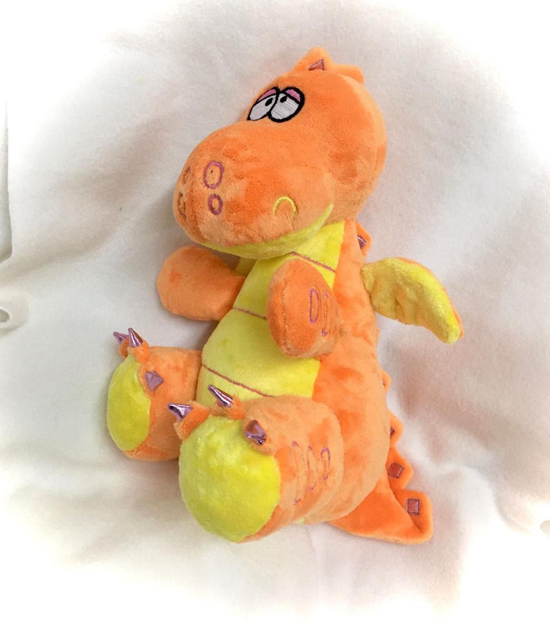 Custom dragon stuffed animal with a lime belly Custom dragon stuffed animal in orange plush with a striped lime belly, purple claws and spikes, made to order
