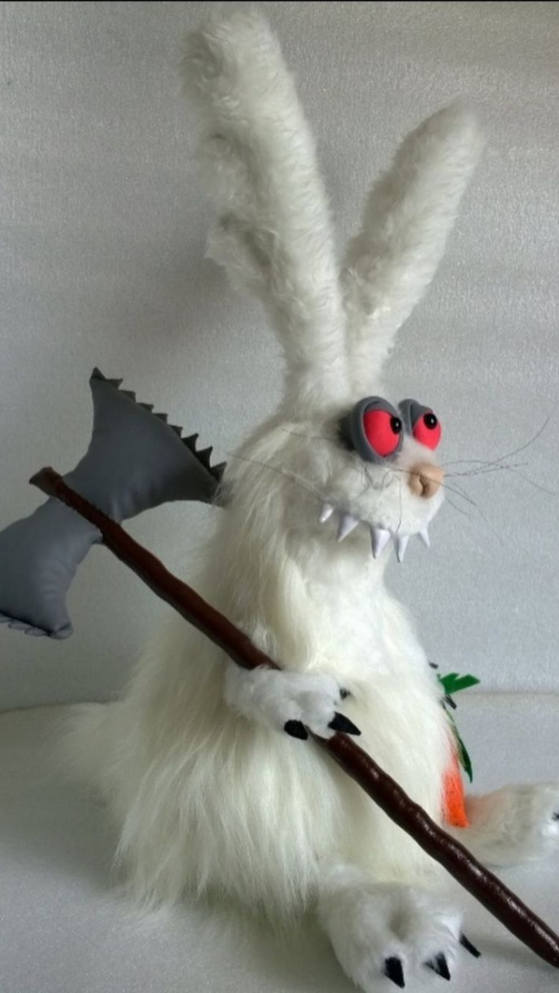Custom evil bunny plush with an axe, sewn to order: grey jagged blade, red eyes, white fangs, long whiskers