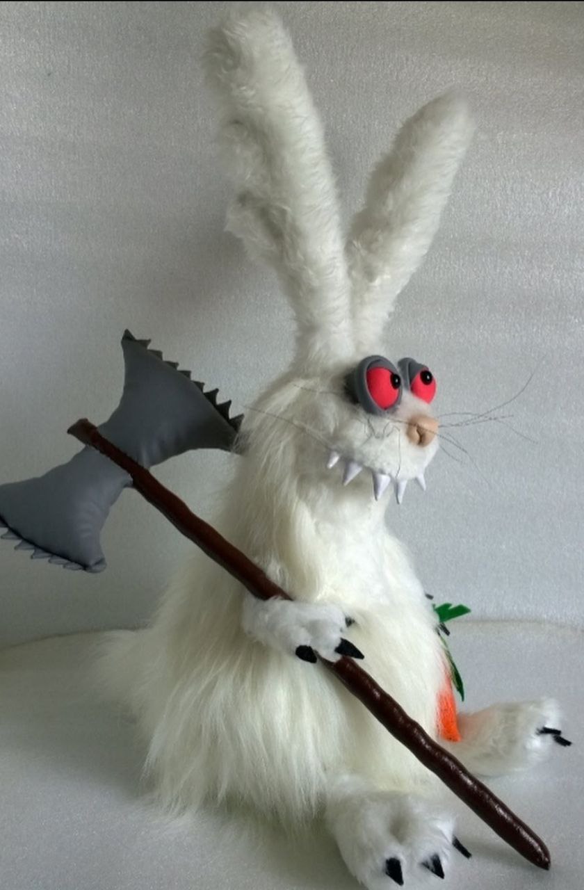 Custom evil bunny plush with an axe Custom evil bunny plush with an axe, sewn to order: grey jagged blade, red eyes, white fangs, long whiskers