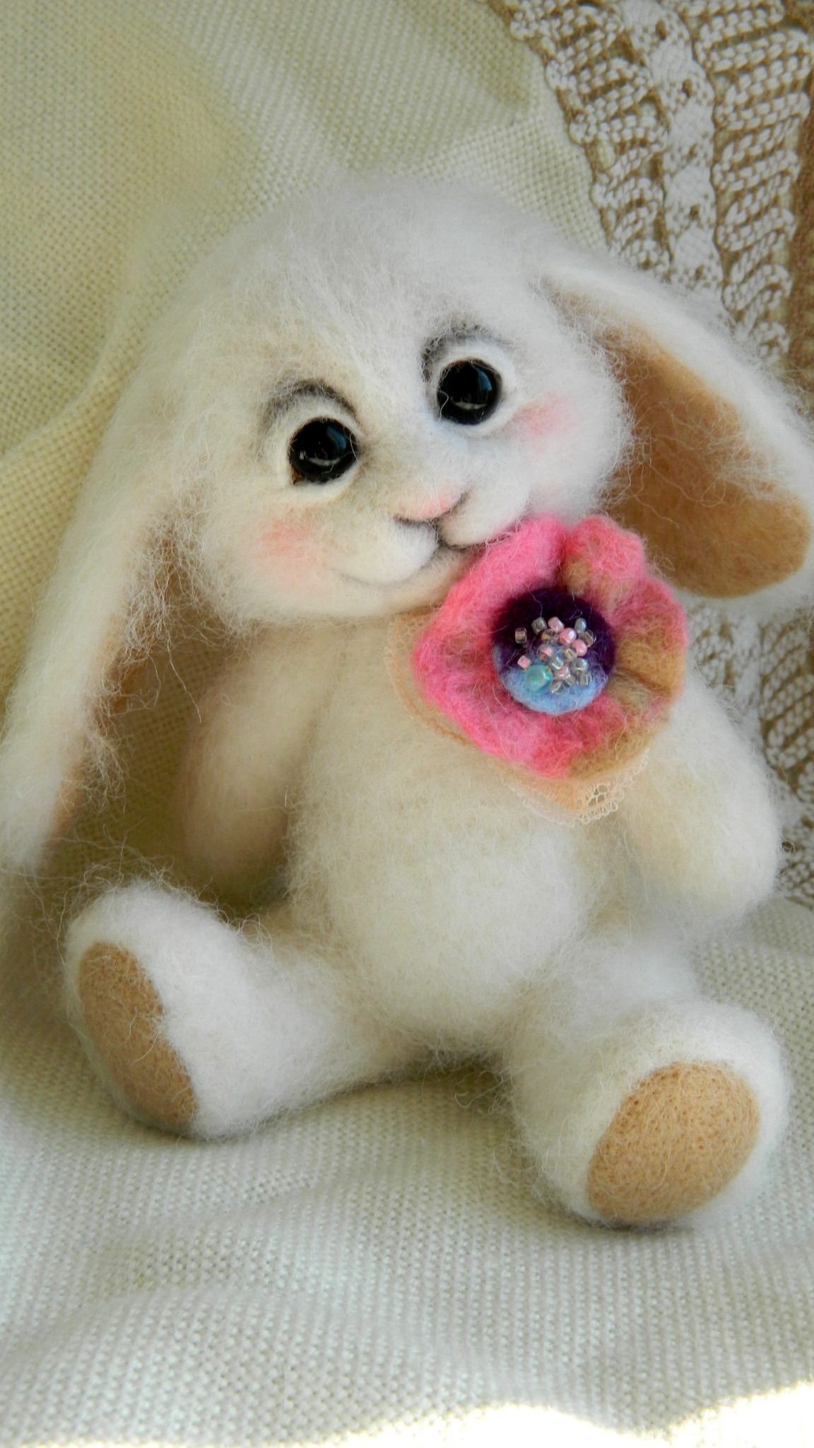 Custom felted bunny, handmade to order: pink wool flower with glass beads and lace, smiling face, lop ears