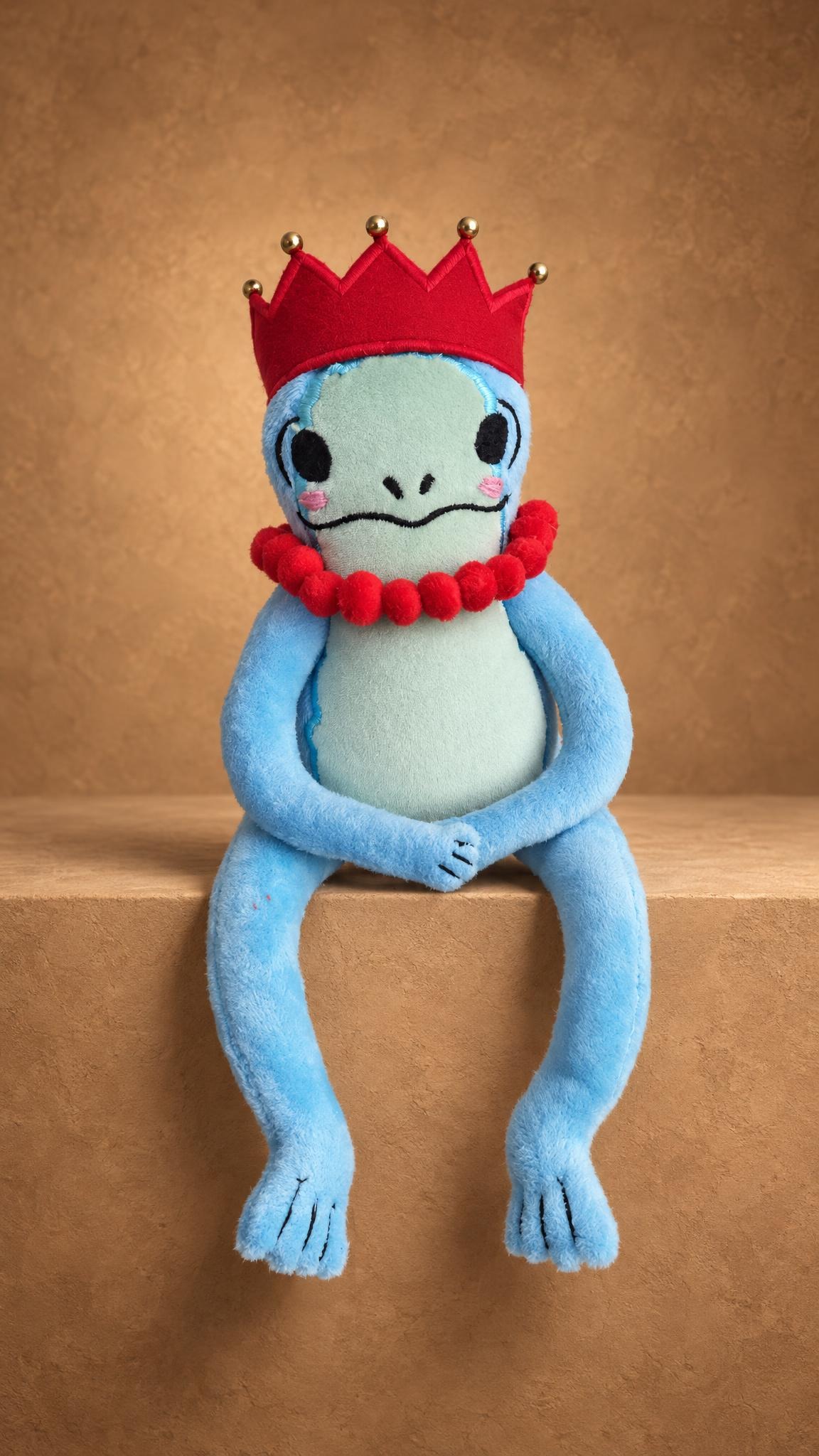 Custom frog princess plush sewn to order: blue frog with mint face, red crown and long legs hanging down