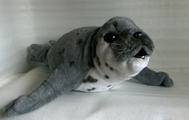 Custom grey seal stuffed animal Custom grey seal stuffed animal with dark spots on a white belly and long front flippers, handmade to order