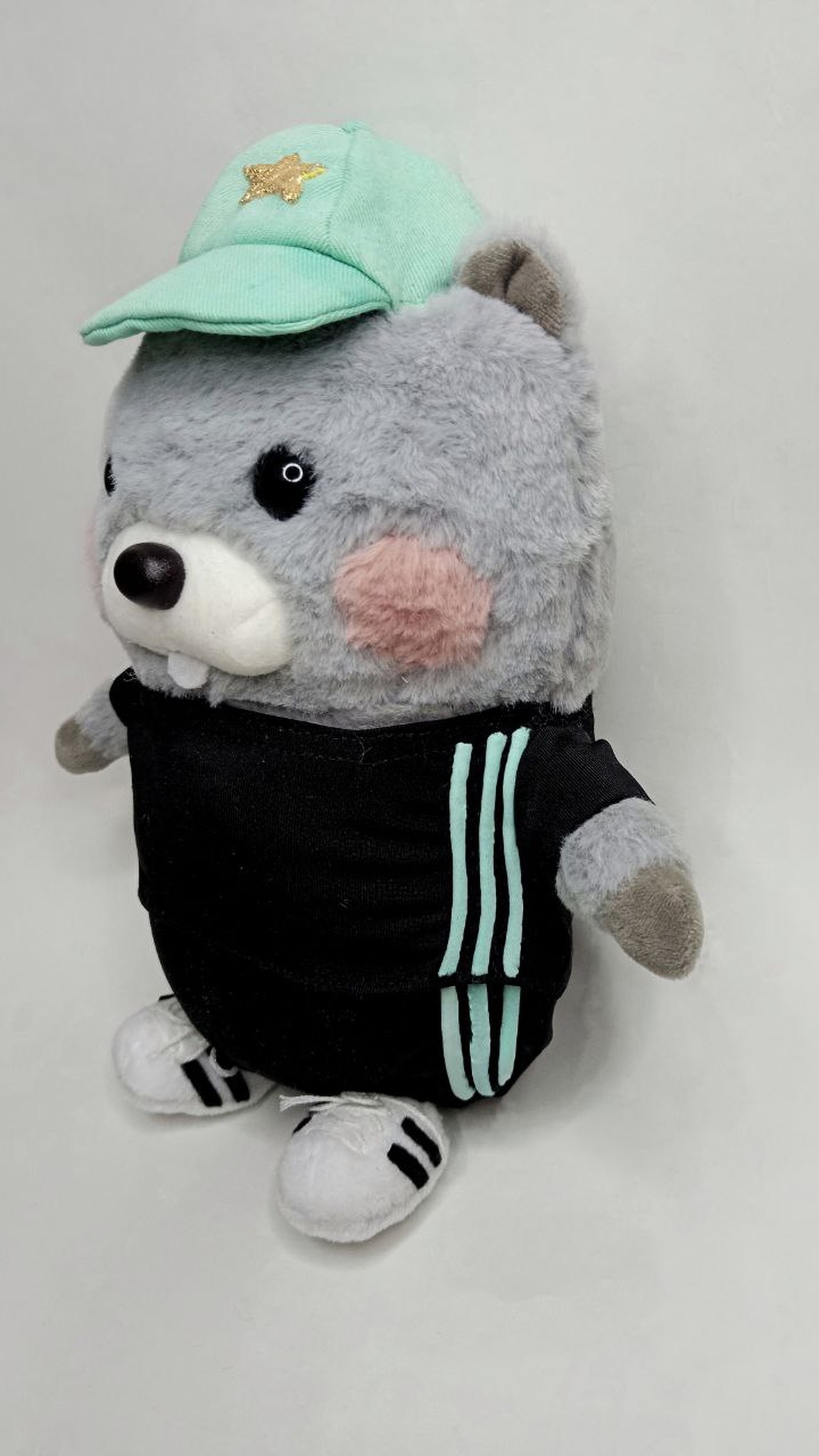 Custom hamster plush from a child's drawing: three mint stripes down the black tracksuit, white sneakers
