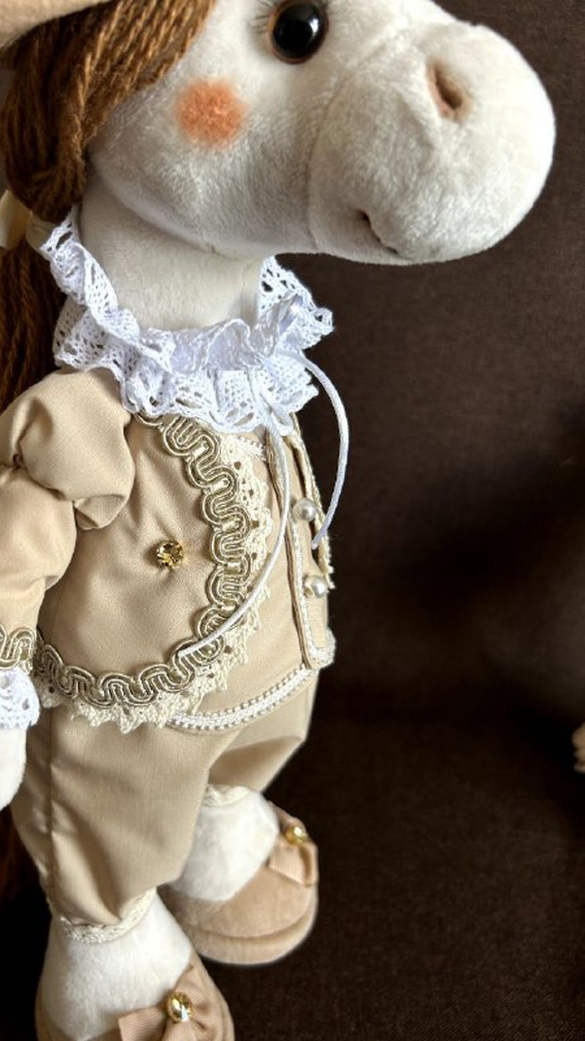Custom horse plush in a beige suit with braid trim, buttons and a lace collar, corporate gift made to order