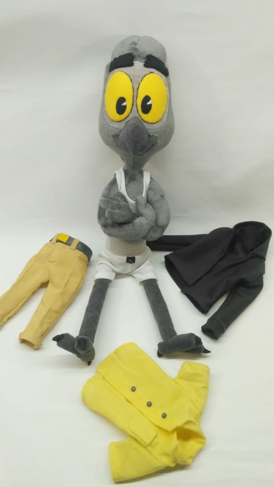 Poseable Mark Beaks plush with crossed arms, his DuckTales outfit laid out around him, custom made to order