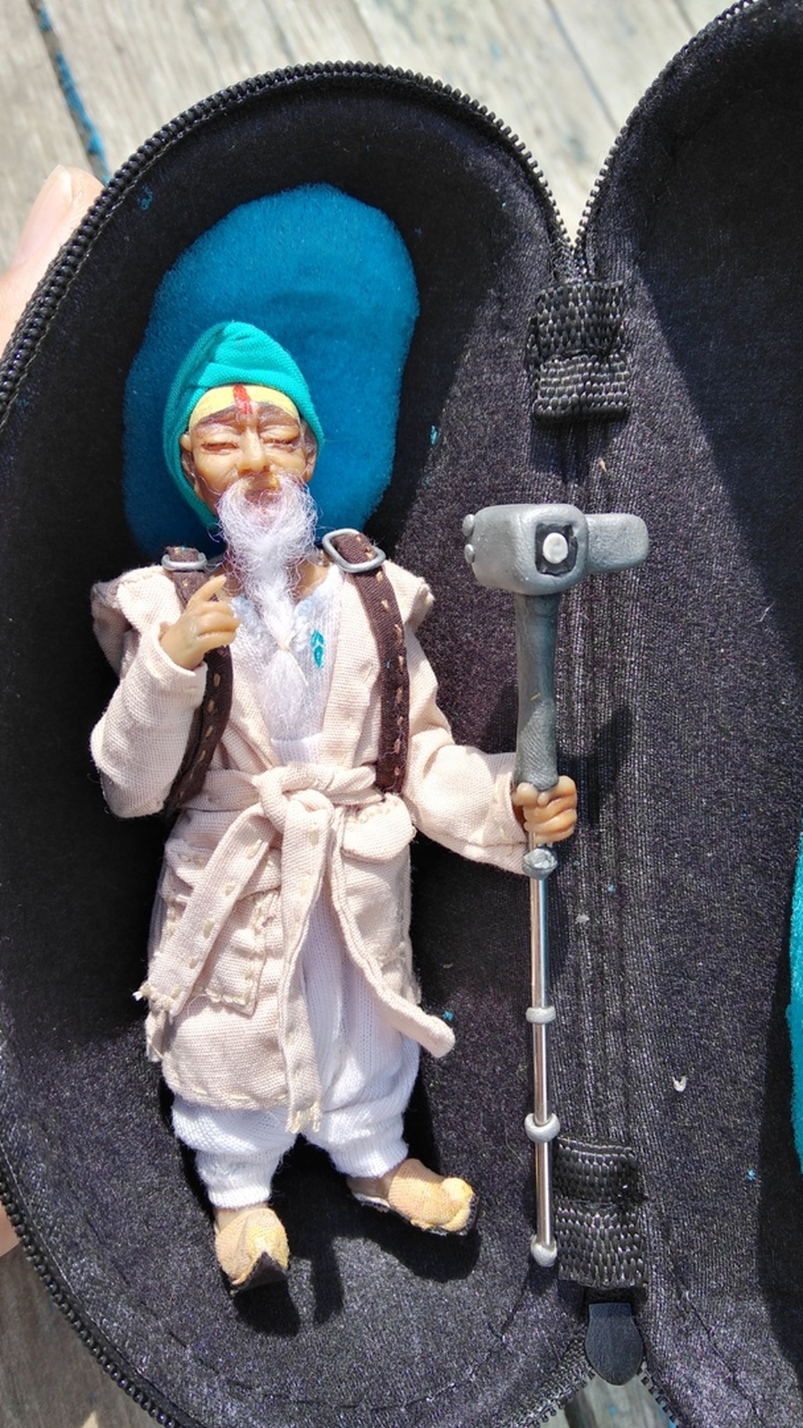 Handmade traveler mascot doll in a zip travel case with a soft lining, made to order for a travel brand
