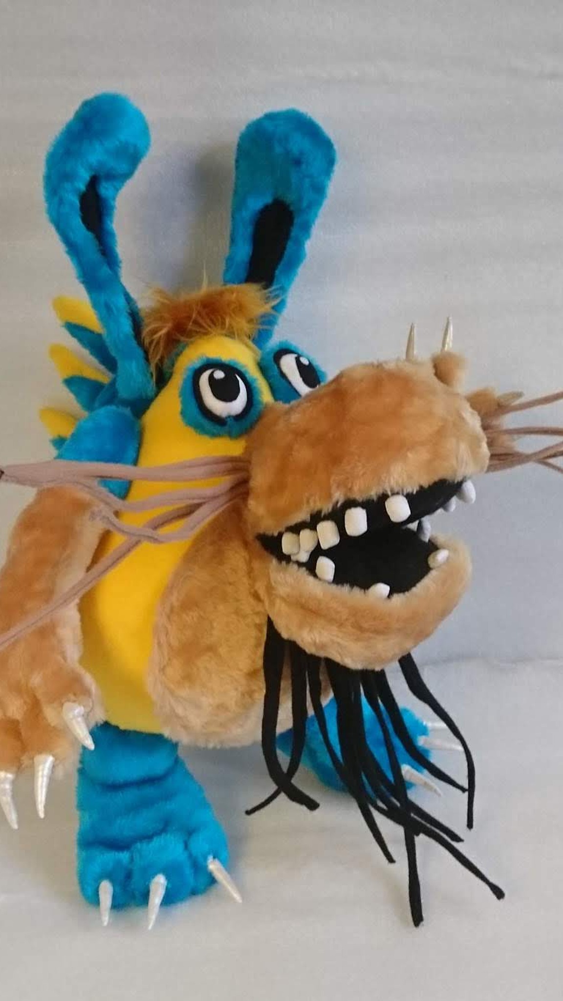 Custom monster plush of Shtusha-Kutusha in bright blue faux fur, handmade to order with a tan toothy muzzle