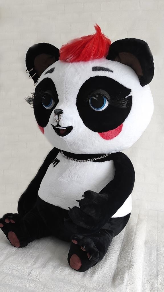 Custom panda mascot with red mohawk Custom panda mascot plush face: red mohawk, blue eyes with long lashes, nose ring and pink tongue