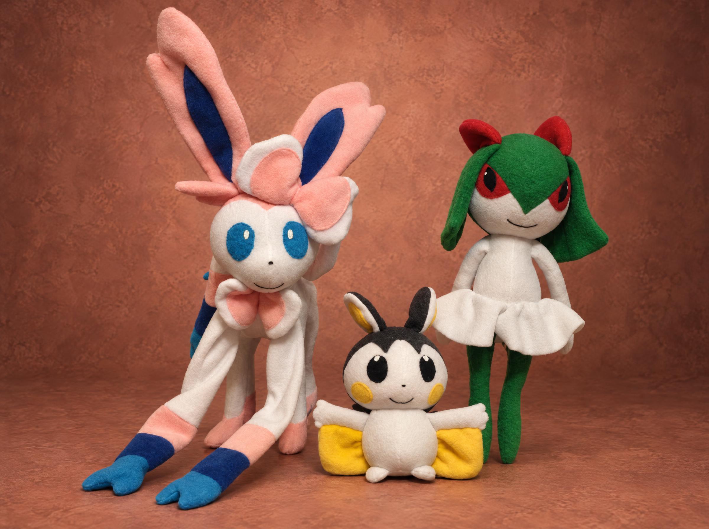 Custom Pokémon plush trio: Sylveon, Emolga and Kirlia, sewn by hand to order from a fan's drawings