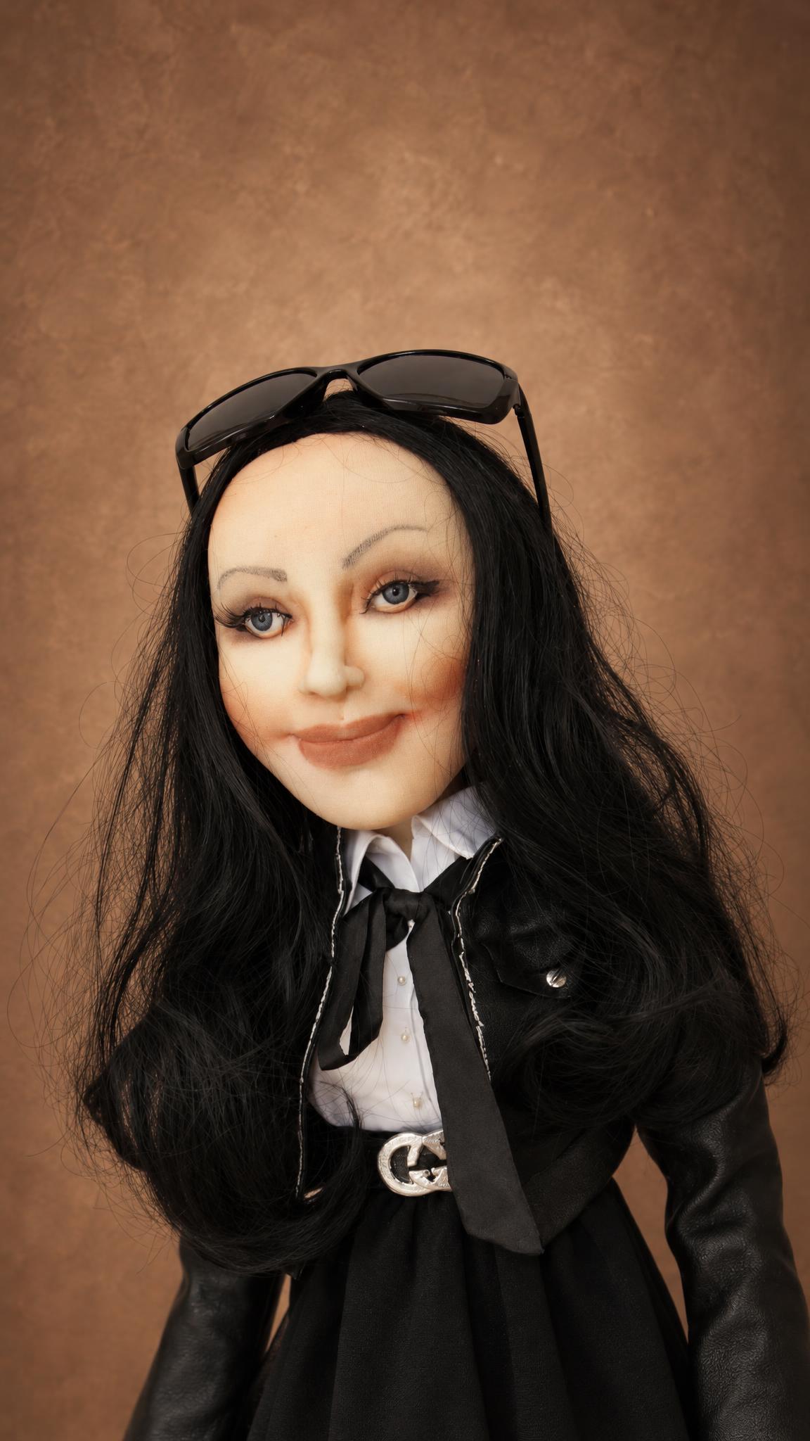 Custom portrait doll of a girl with long black hair, white shirt, black tie and silver buckle, sewn from a photo