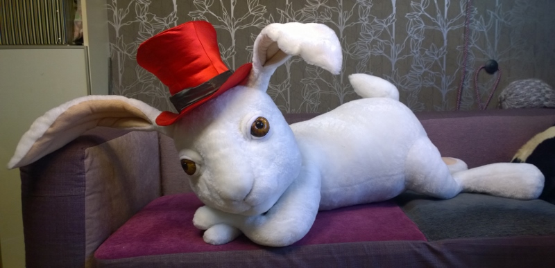Custom rabbit plush, theater prop Custom rabbit plush made as a theater prop: white faux fur, crooked red top hat, one ear flopped over