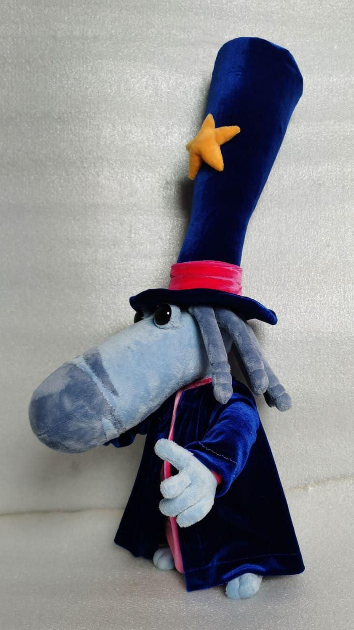 Custom Rayman Magician plush showing off his long light-blue nose and tall bendy star hat, sewn to order