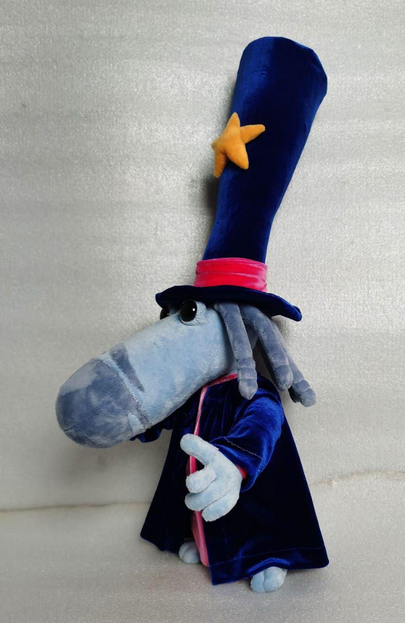 Rayman Magician plush and his long nose Custom Rayman Magician plush showing off his long light-blue nose and tall bendy star hat, sewn to order