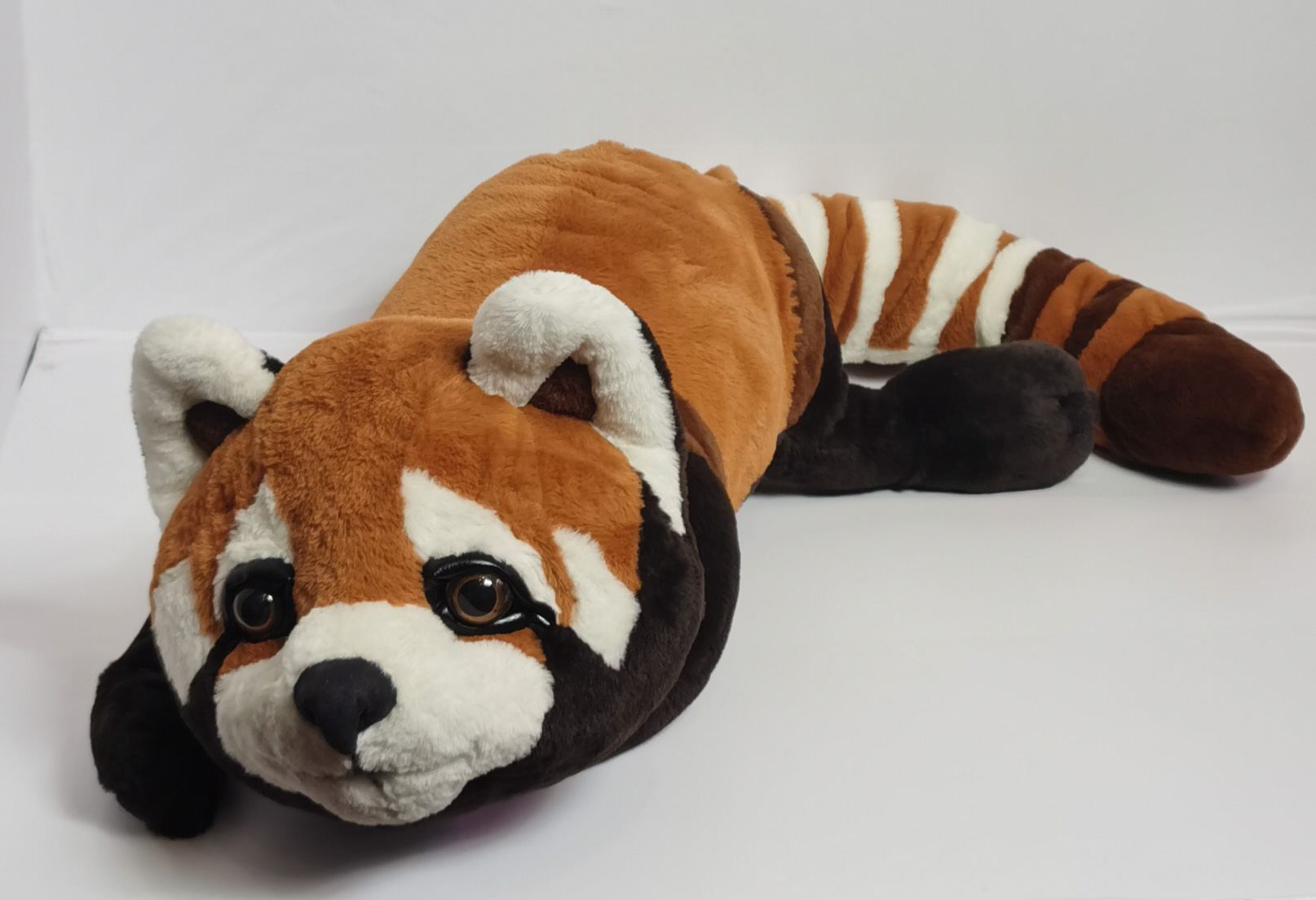 Custom red panda plush gift Custom red panda plush made as a gift, soft rust and cream plush with dark legs reaching forward