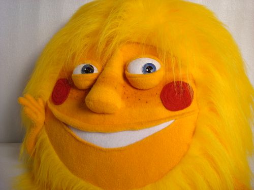 Custom sun stuffed toy, smiling face Custom sun stuffed toy made to order: freckled orange face, blue eyes, red cheeks and a big white smile