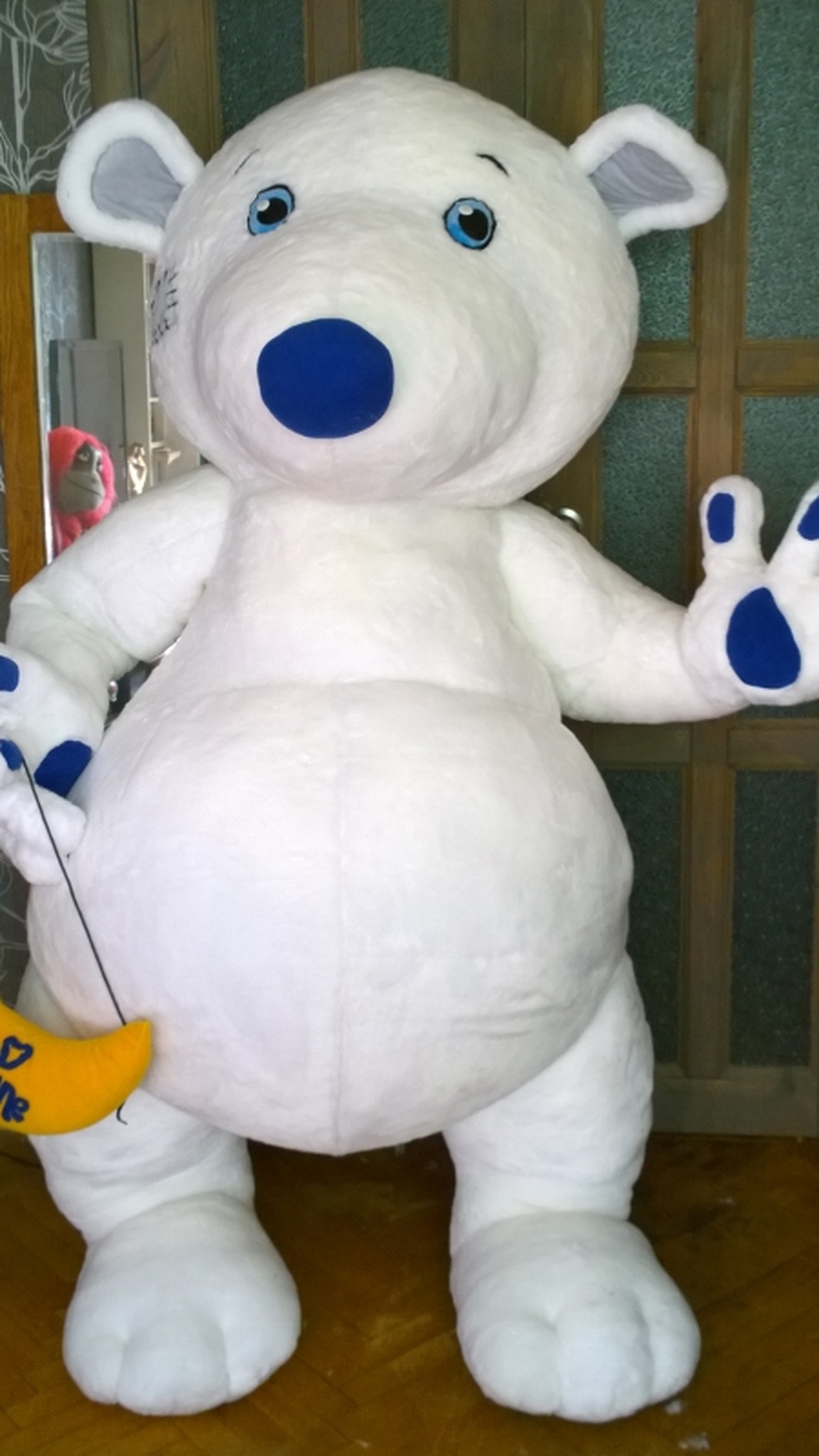 Custom teddy bear mascot about 5 feet tall, white plush with blue hands, sewn to order for an exhibition