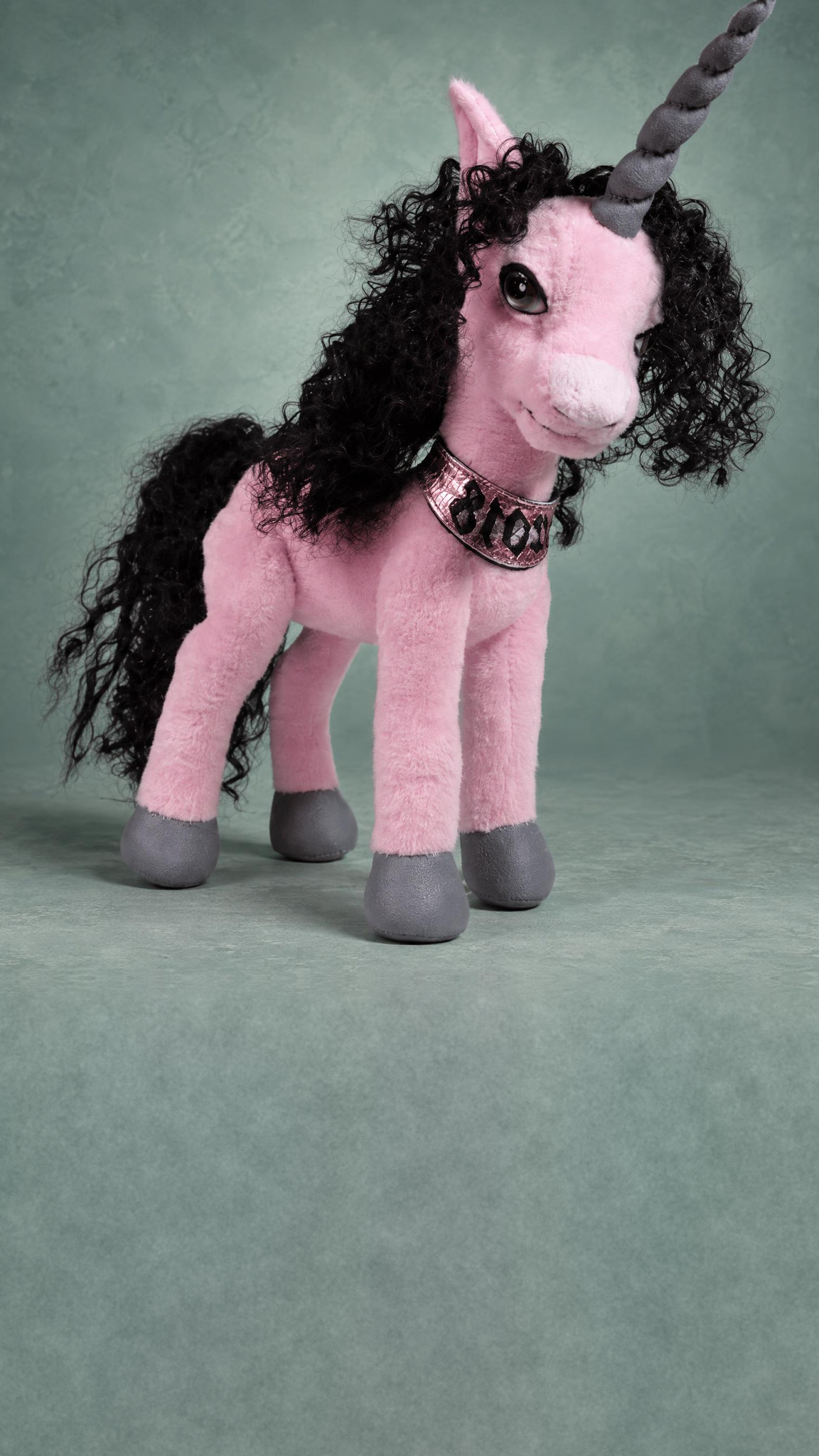 Pink unicorn stuffed animal, custom made to order, on long slim legs with a long curly black tail