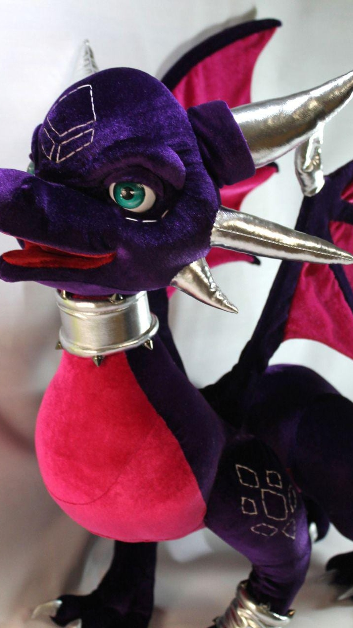 Cynder plush with magenta belly, spiked silver collar and stitched hip markings, sewn by hand to order