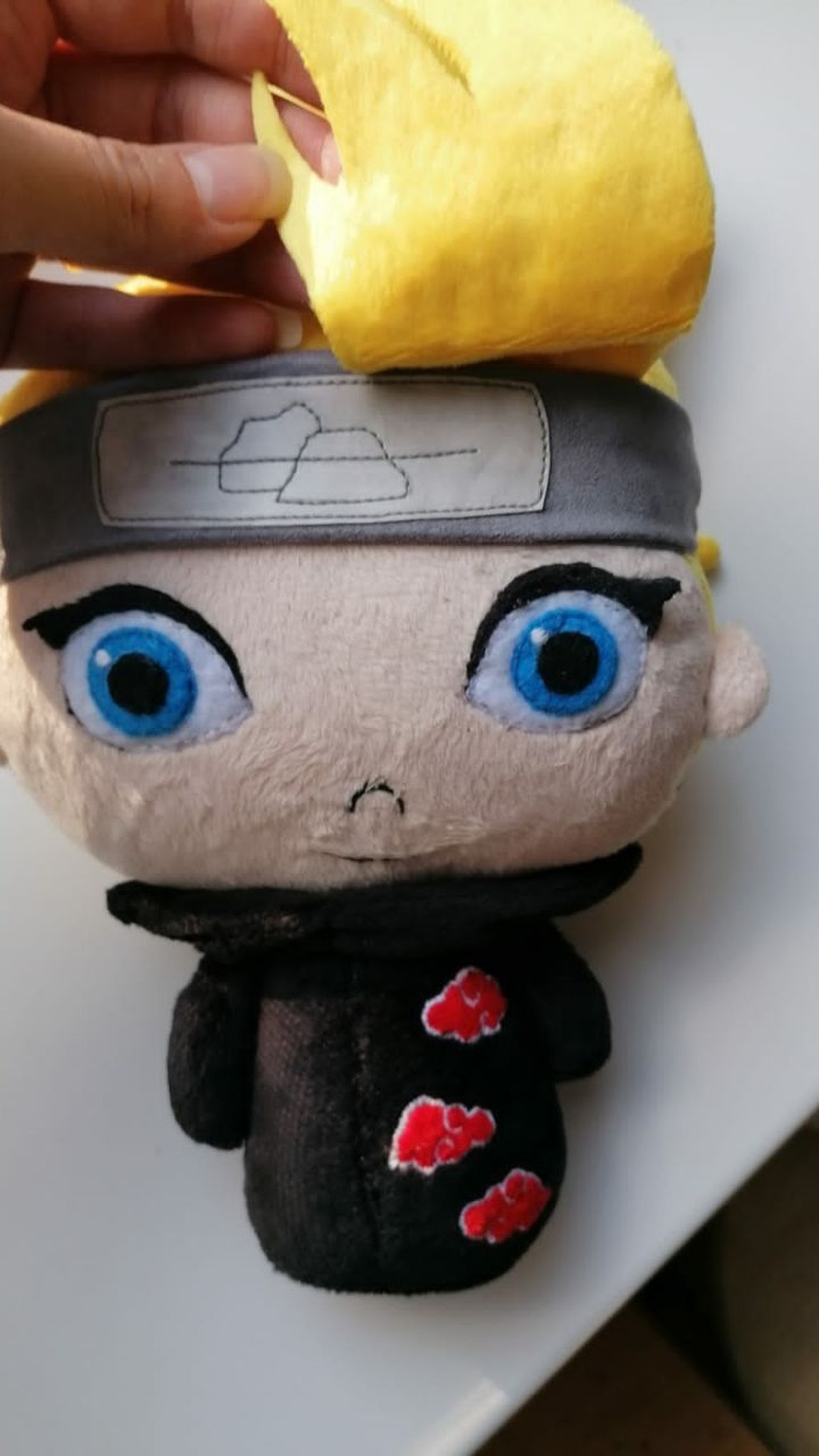 Deidara plush with the bang lifted to show both blue eyes and the Stone Village headband, made to order