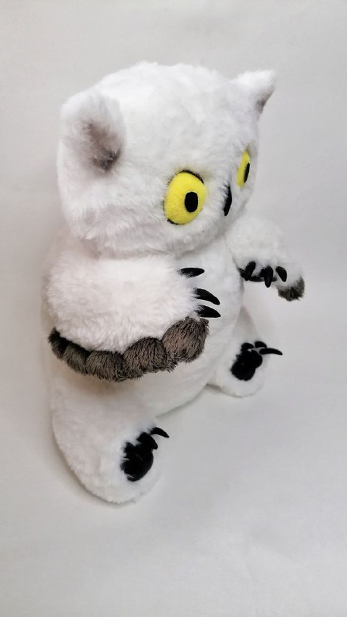 D&D owlbear plush handmade to order: white faux fur, grey ear tips, startled yellow eyes and a feather wing