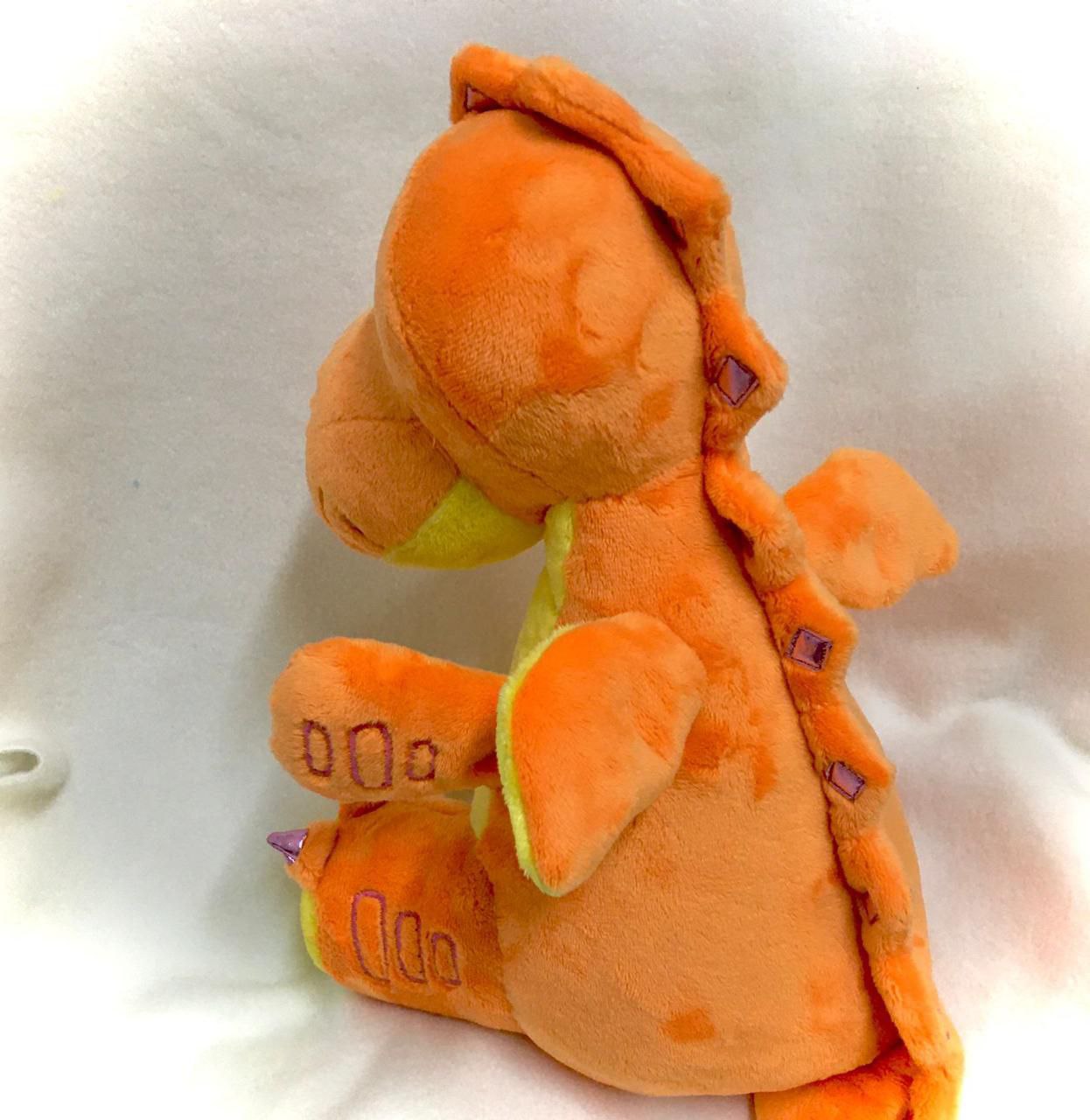 Dragon plush replica with purple back spikes Dragon plush replica with purple spikes down an orange back, lime wing and stitched toe lines, handmade copy