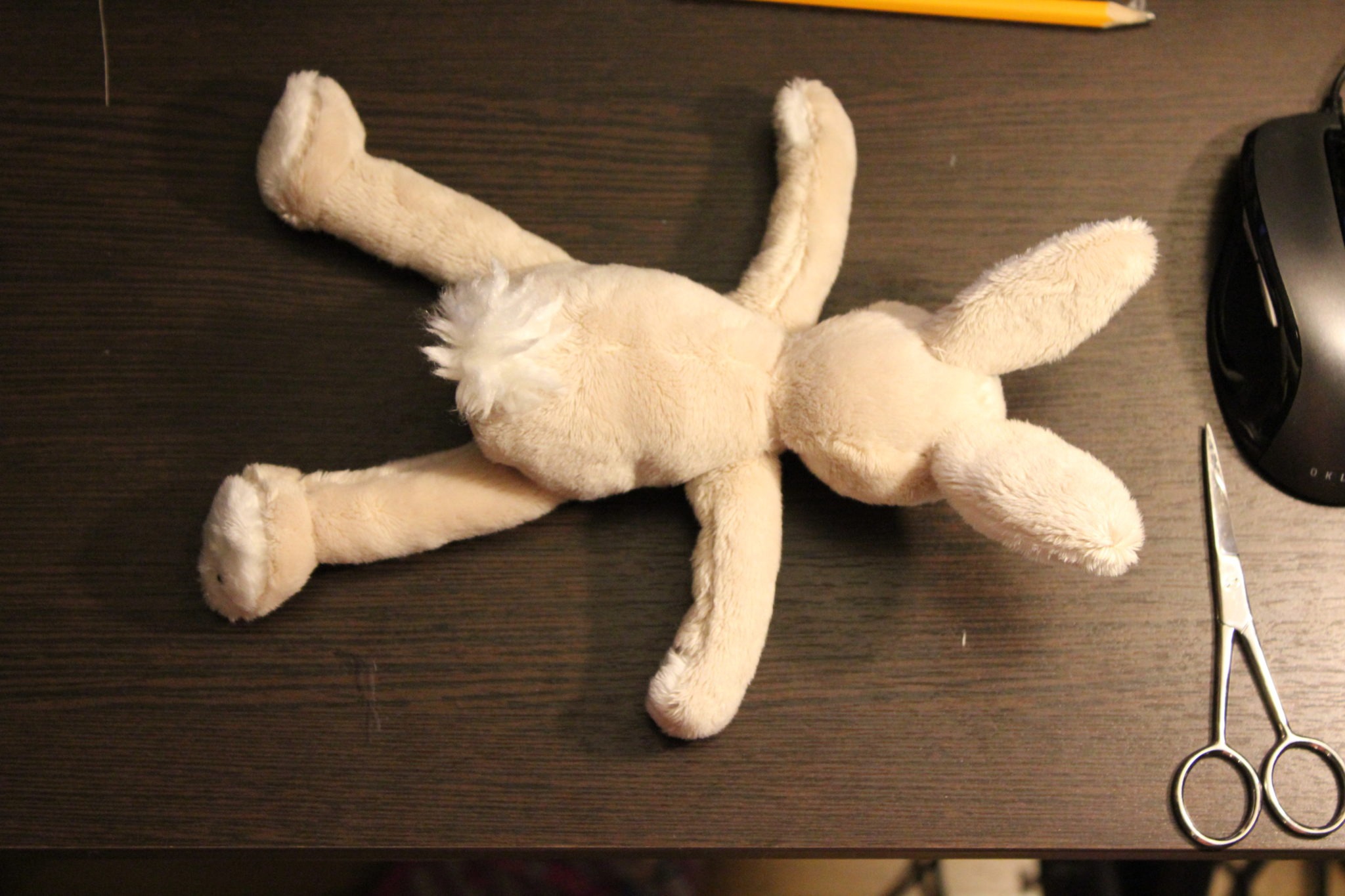 Duplicate bunny plush with a white tail Duplicate bunny plush with a fluffy white tail and long cream limbs, a handmade copy of a favourite toy