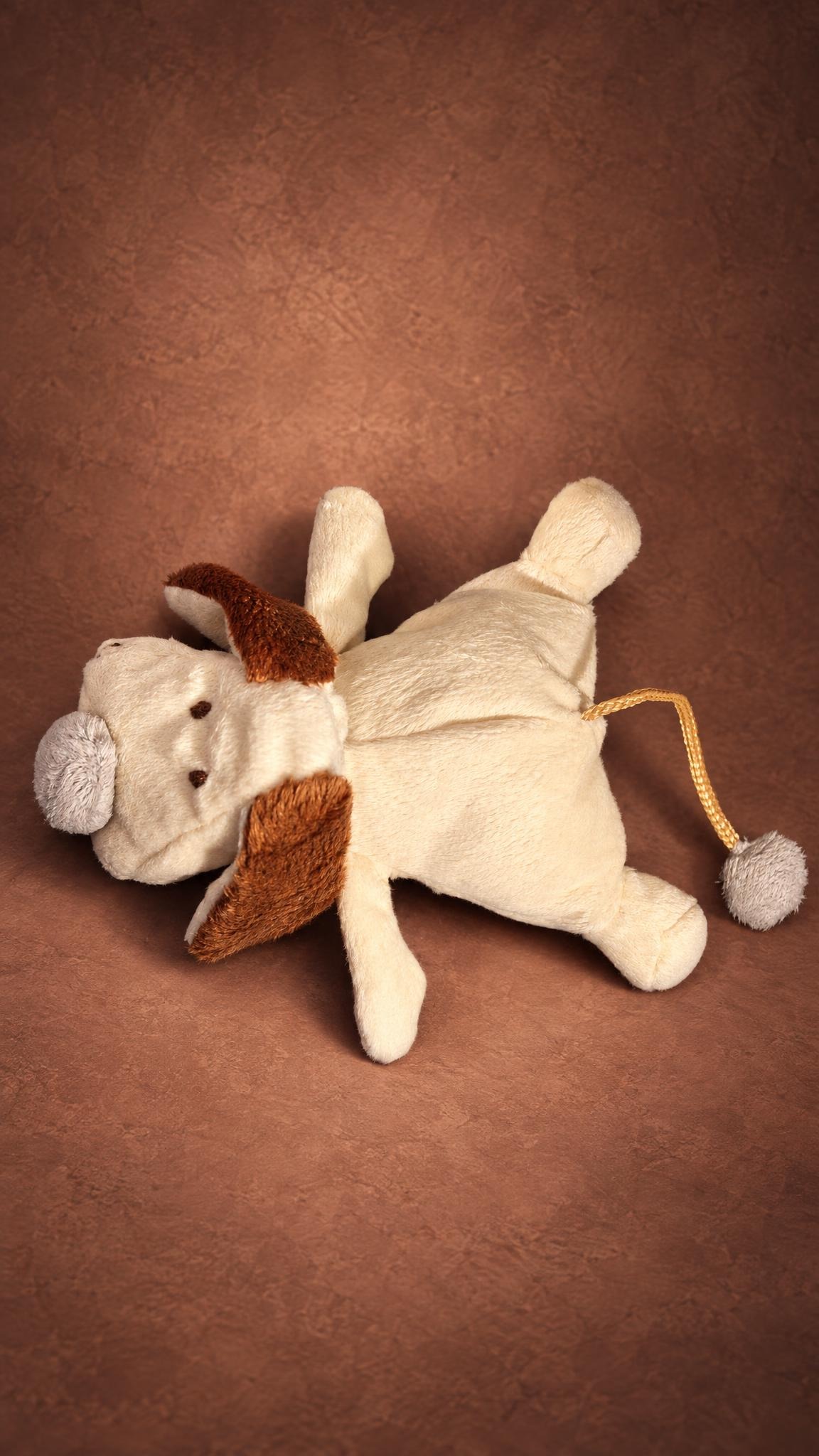 Copy of a favourite stuffed dog in cream faux fur with brown ears and grey nose, handmade to order