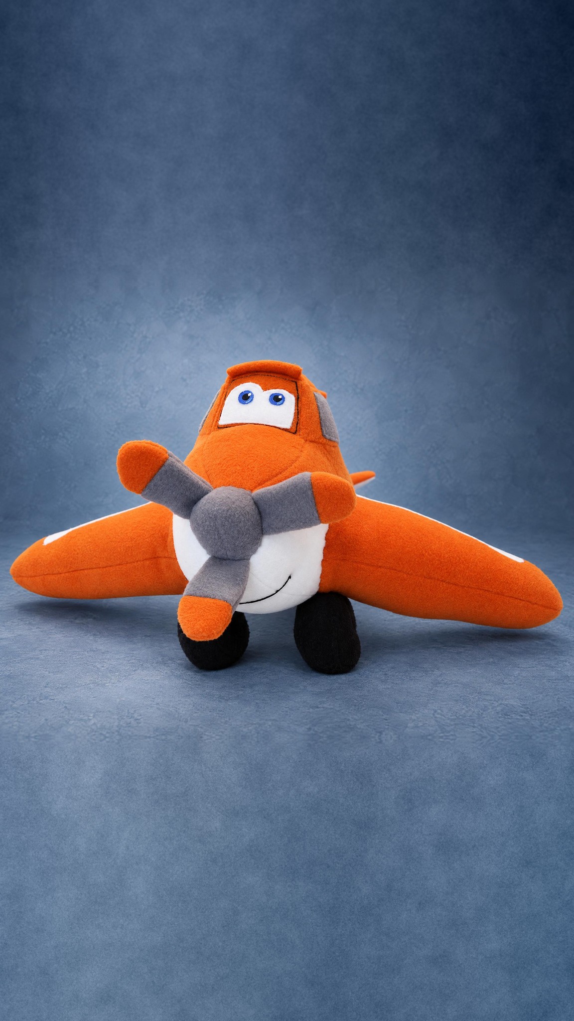 Handmade Dusty plush from Planes, a smiling orange crop duster toy with a three-blade propeller, made to order