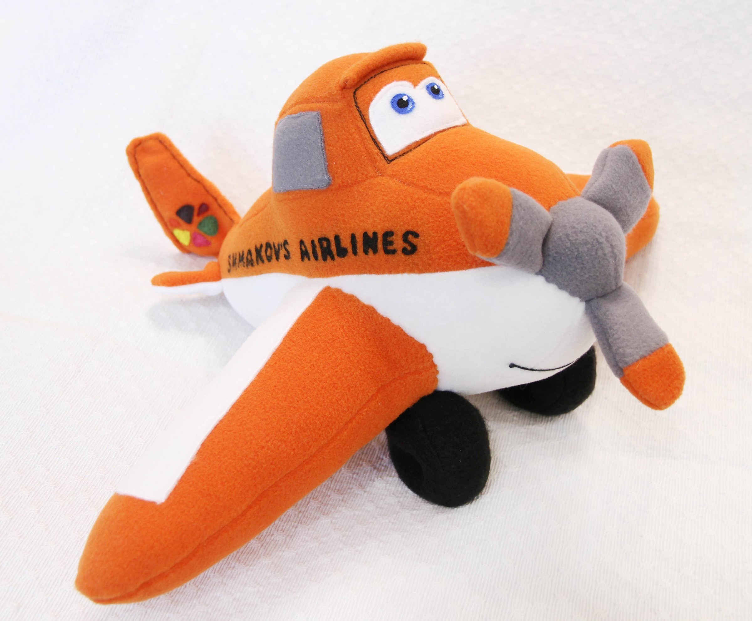 Dusty plush with airline lettering and tail emblem Dusty plush from Disney Planes with Airlines lettering and a colorful tail emblem, custom plane made to order