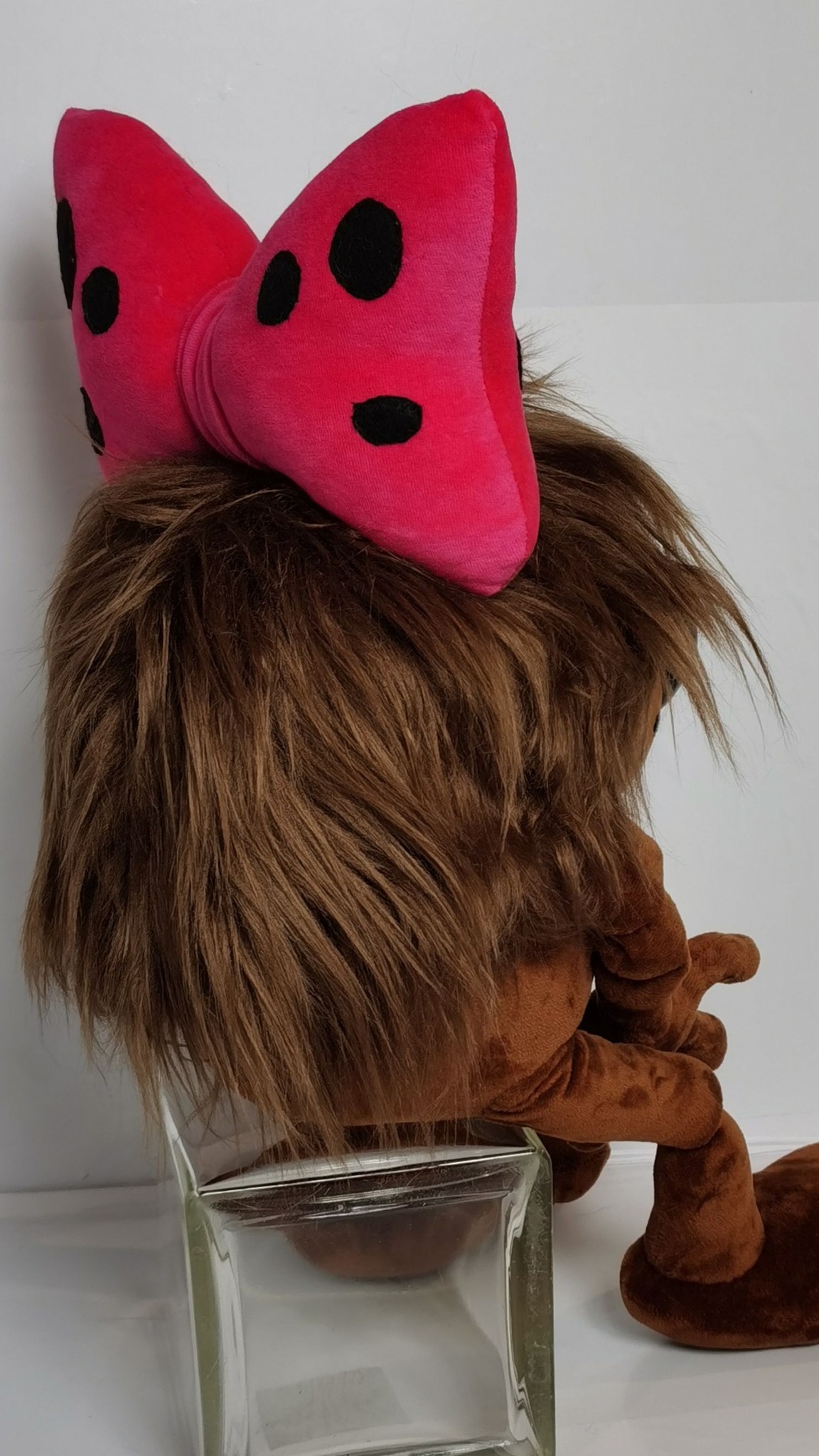 Dyudyuka cartoon plush, handmade to order: long shaggy brown faux fur hair down her back under a pink bow