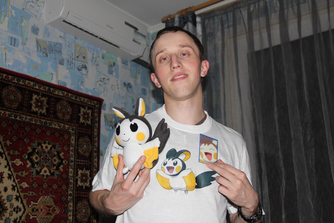 Emolga plush with its owner Customer in an Emolga T-shirt holding his handmade Emolga plush, a custom Pokémon toy sewn to order