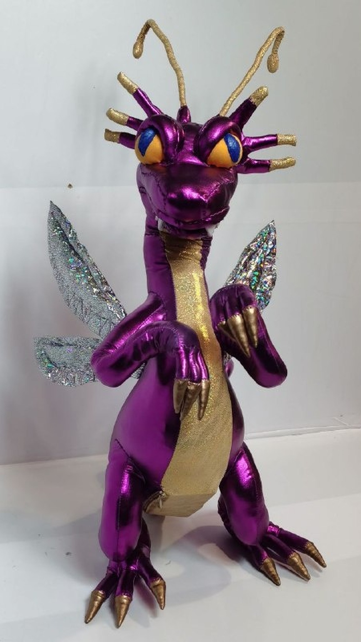 Custom Faerie Dragon plush with gold antennae and yellow eyes, the Heroes of Might and Magic purple dragon