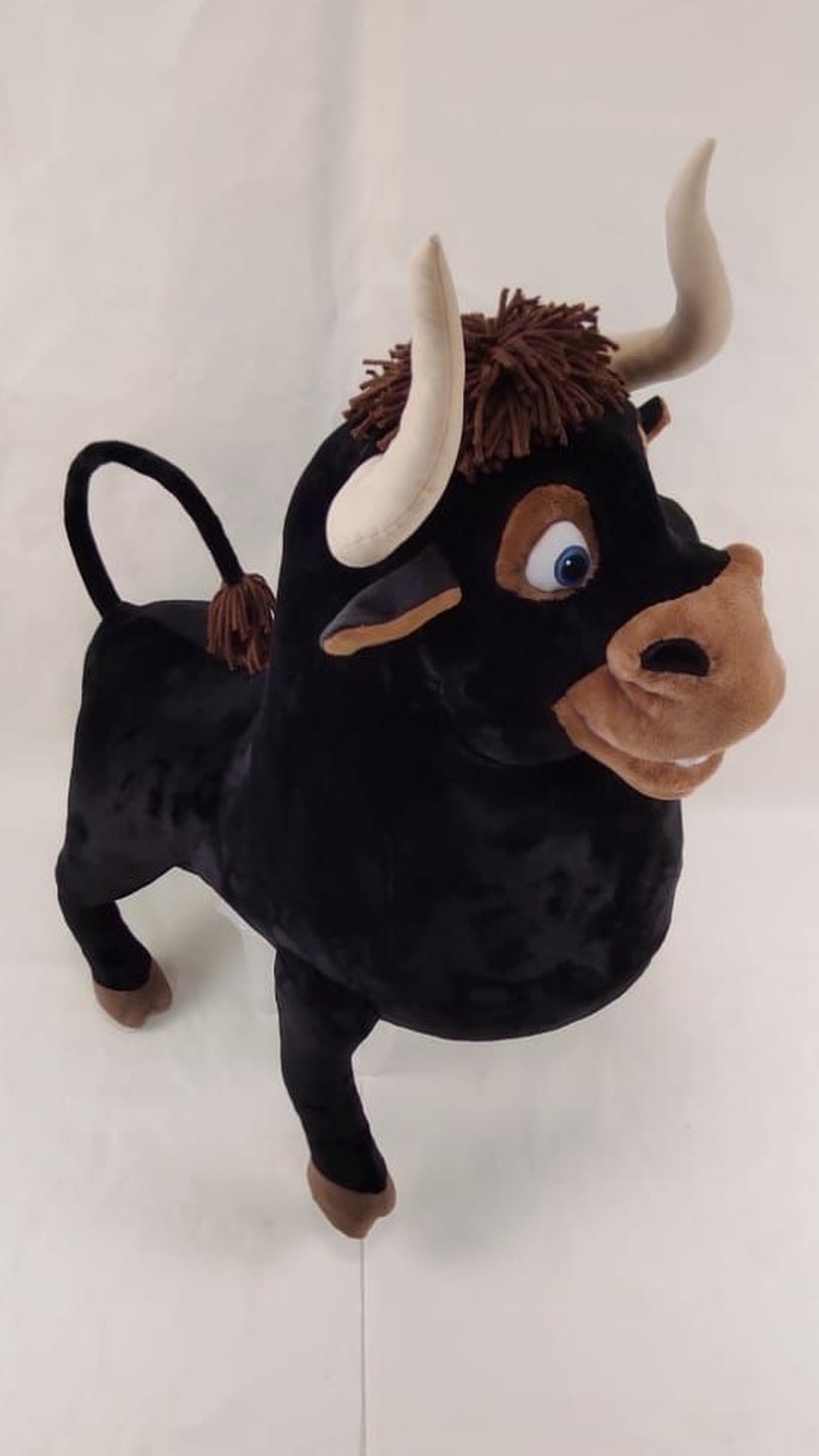 Custom Ferdinand the Bull plush with curled tail, soft beige horns and blue eyes, handmade to order