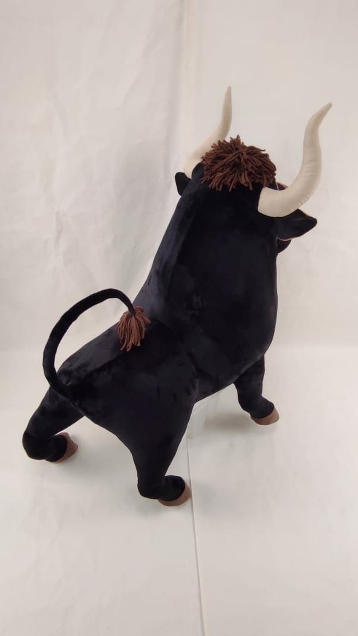 Ferdinand stuffed animal with brown yarn tuft, soft horns and a tasseled tail, sewn by hand to order