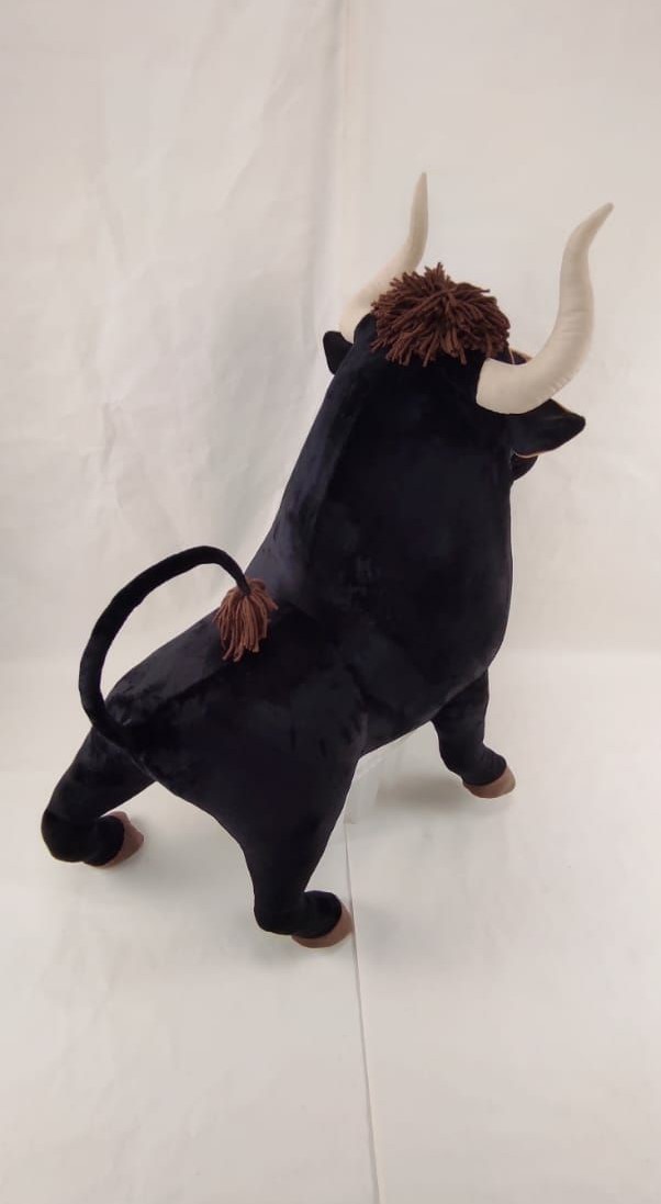 Ferdinand stuffed animal with yarn tuft Handmade Ferdinand stuffed animal with a shaggy brown yarn tuft between soft horns, black plush body