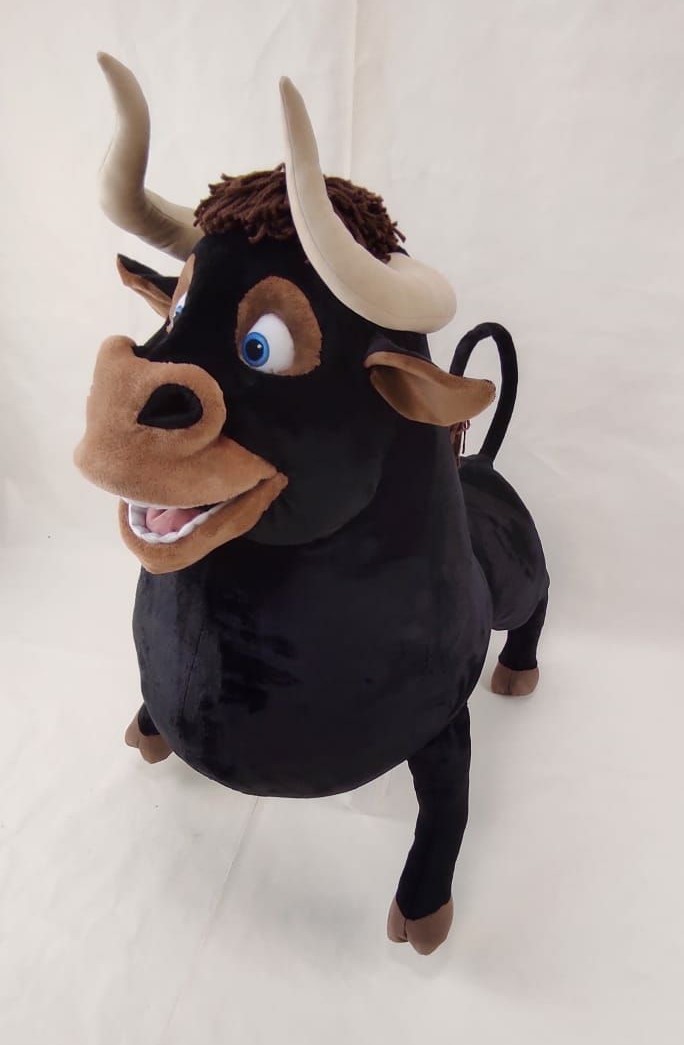 Smiling Ferdinand plush Ferdinand plush with a wide goofy smile, blue eyes and pale horns, the gentle bull sewn by hand to order