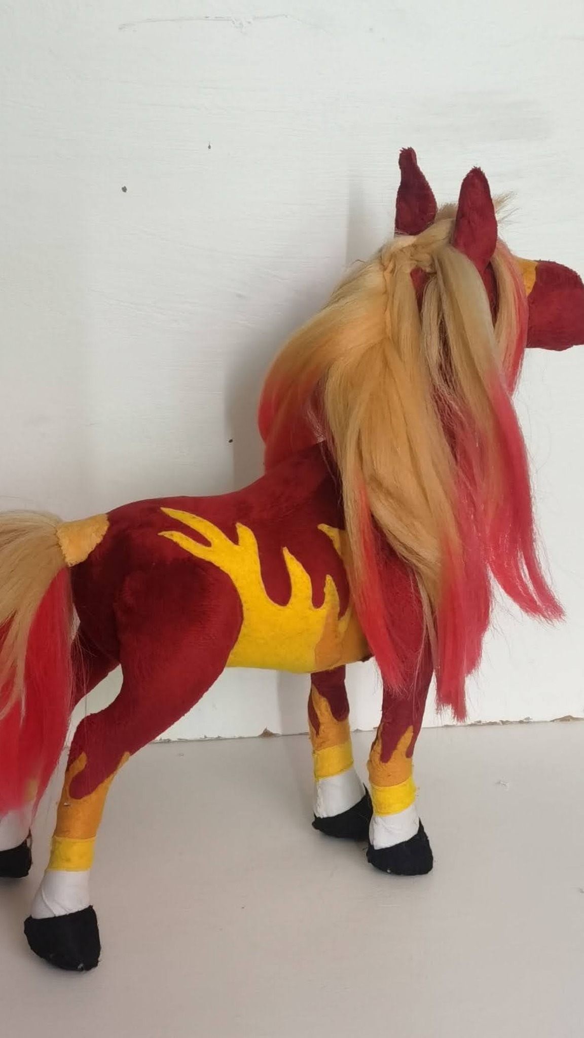 Fire horse plush with flame appliques on the belly and legs and a braided blonde mane, custom made to order