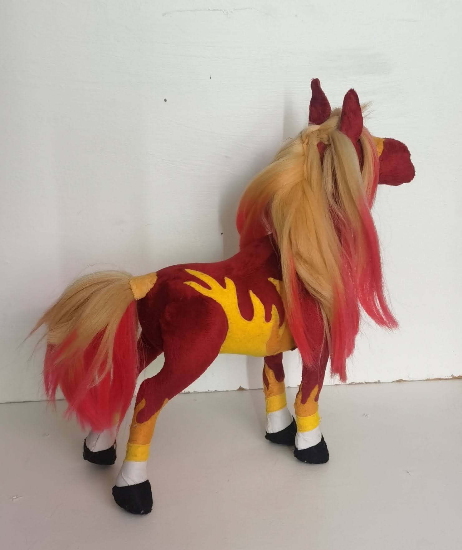 Custom horse plush with flame appliques Custom horse plush with yellow flame appliques along the belly, braided blonde mane and red-tipped tail, handmade
