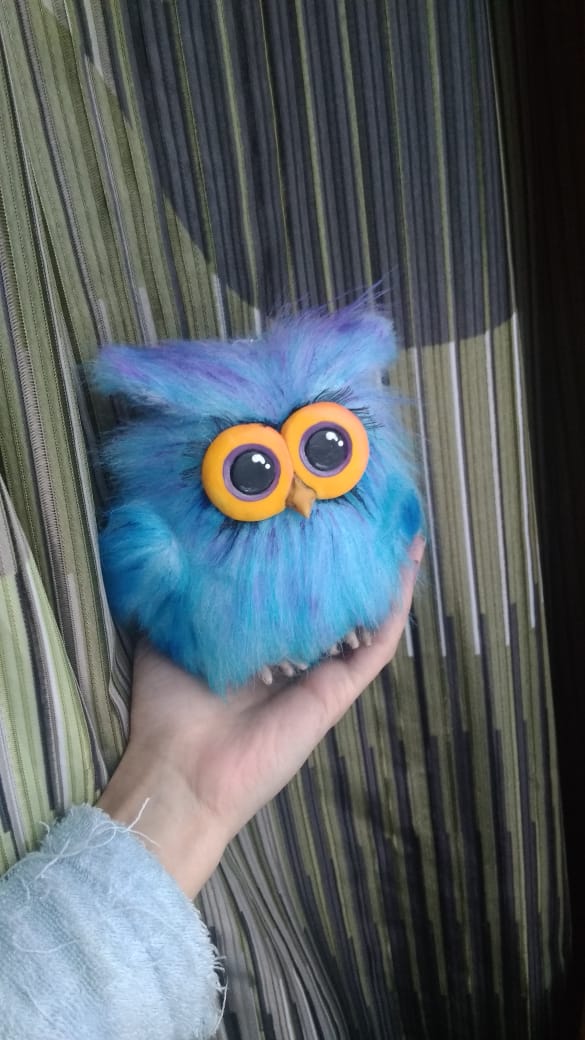 Fluffy blue owl keychain plush Fluffy blue owl keychain plush made to order for a child: sculpted clay feet under the fur, big orange eyes