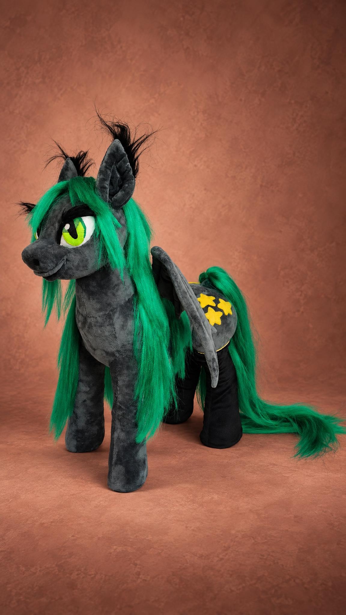 Custom bat pony plush with green eyes, black ear tufts and a star cutie mark, made to order from a picture