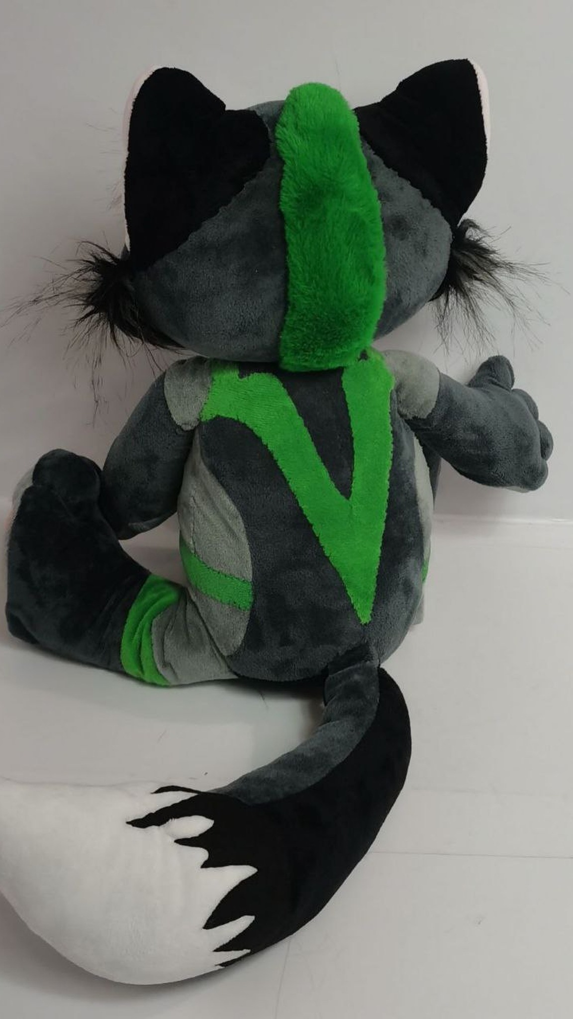 Fox fursona plush back with a green stripe and a white-tipped tail, sewn to order