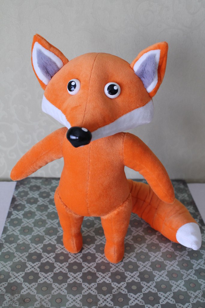 Fox mascot plush without his outfit Custom fox plush body before dressing: orange fleece, white chest, lilac ears, sewn as a company mascot