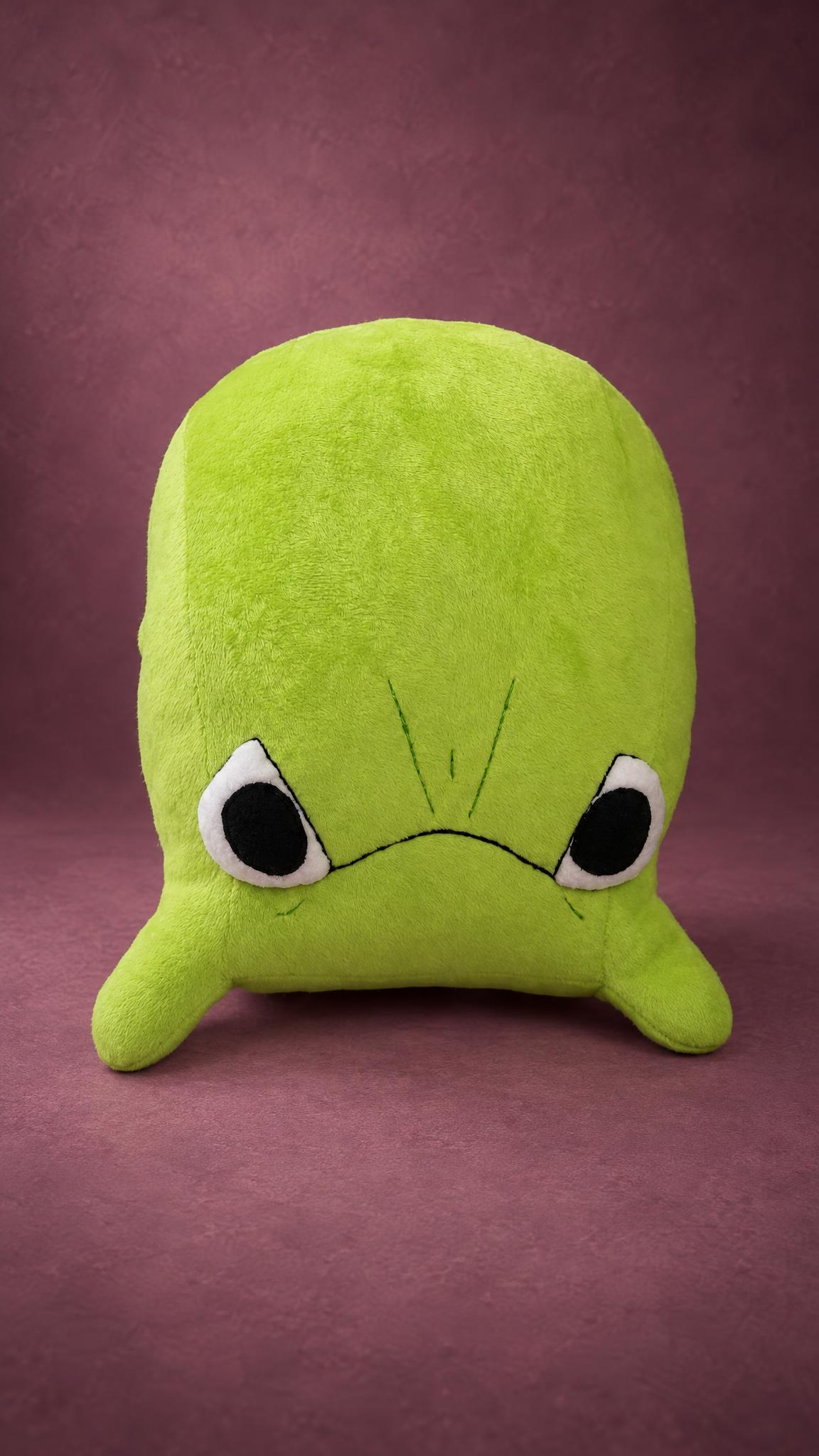 Grumpy toad plush from a messenger emoticon, rounded lime-green body and two short front legs, sewn to order