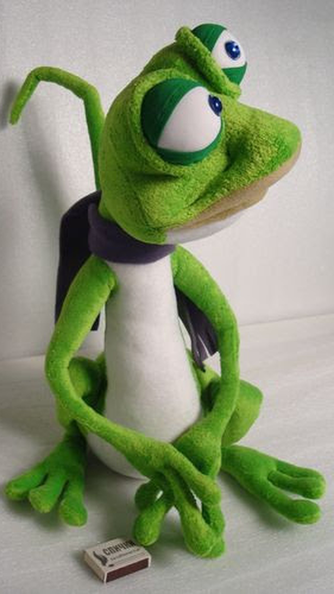 Handmade frog plush with big blue eyes, green lids, purple scarf and long fingers, sewn to order