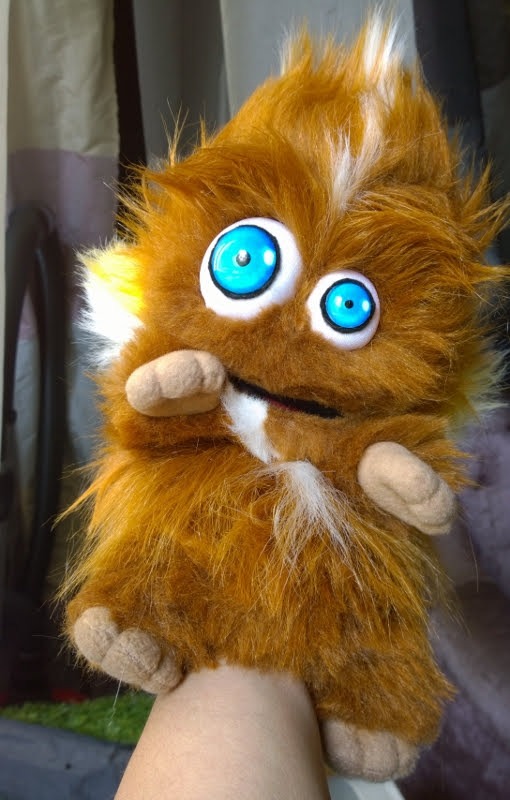 Furry monster hand puppet Furry monster hand puppet worn on a hand, ginger fur, painted blue eyes and soft paws, handmade to order