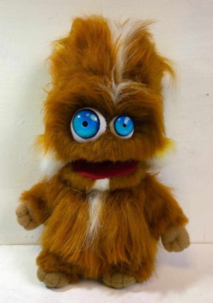 First version of the furry monster plush First version of the furry monster plush: ginger faux fur, big blue eyes and a red open mouth, sewn to order