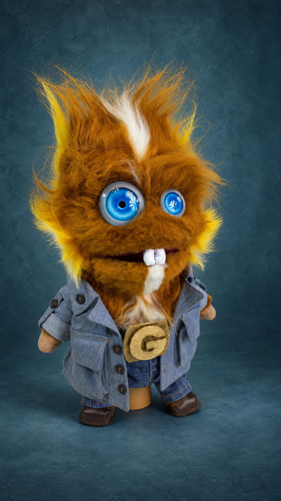 Shaggy ginger monster plush in a denim jacket, jeans and brown boots, sewn by hand to order