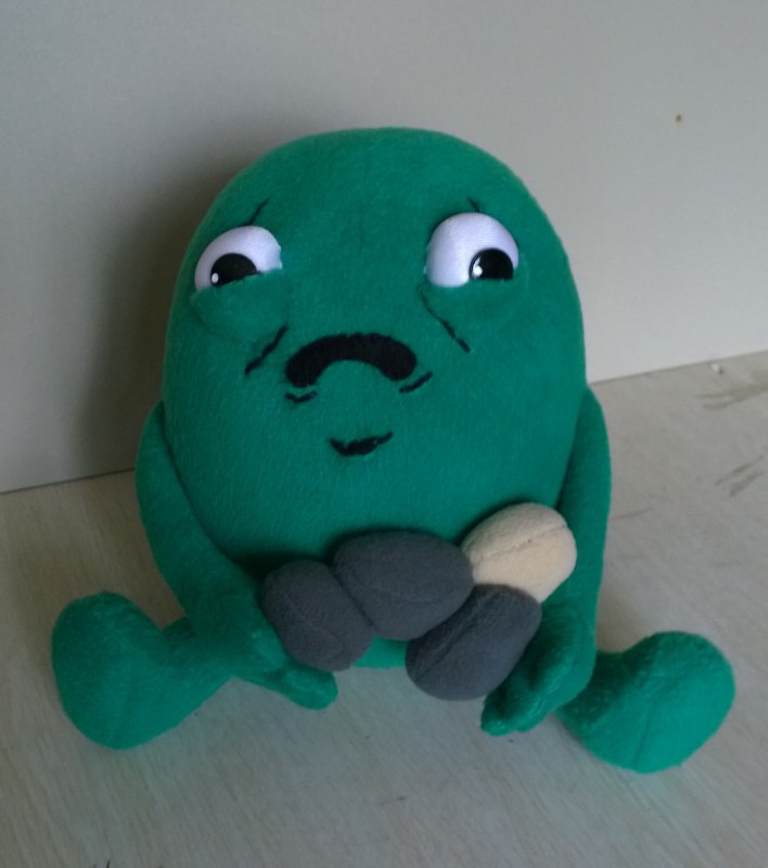 Gallbladder meme plush, sewn to order Gallbladder meme plush sitting with four plush stones, green soft body and stubby legs, custom made to order